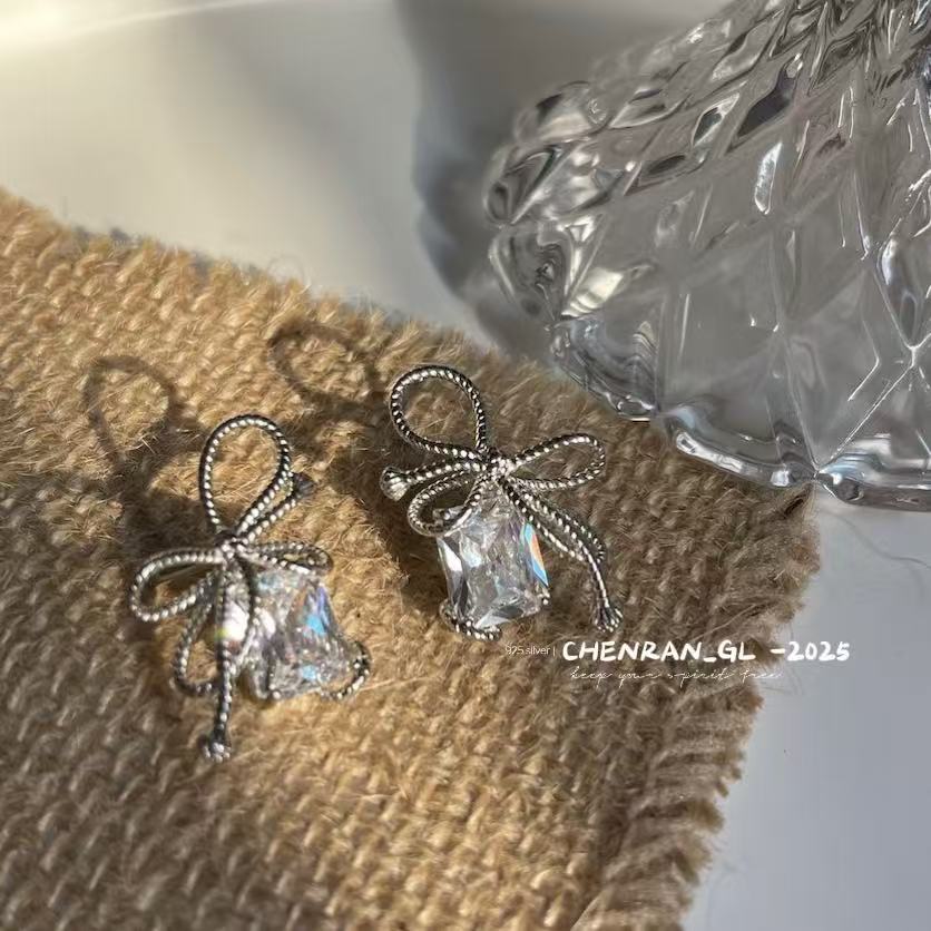 Woven and Twisted Bow Zircon Earrings