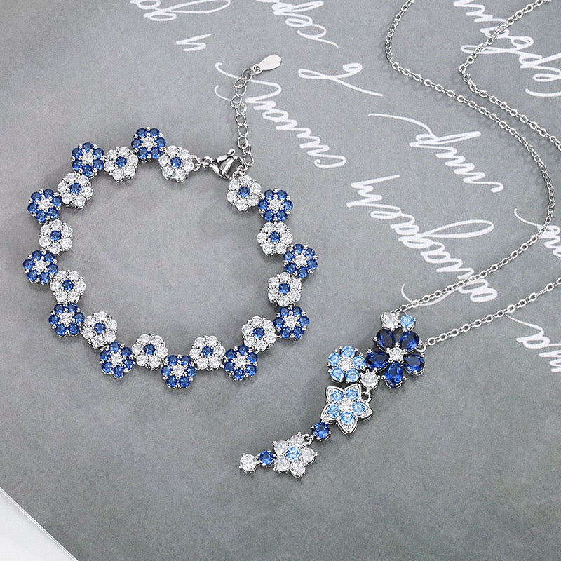 Blue spinel and zircon flower necklace and bracelet set