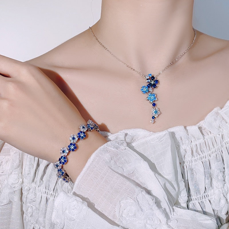 Blue spinel and zircon flower necklace and bracelet set