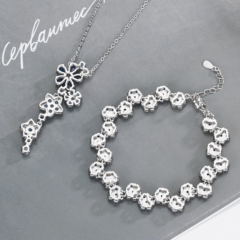 Blue spinel and zircon flower necklace and bracelet set