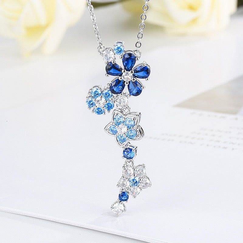 Blue spinel and zircon flower necklace and bracelet set