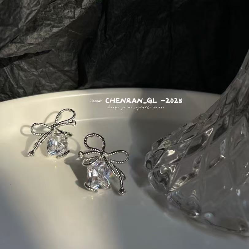 Woven and Twisted Bow Zircon Earrings
